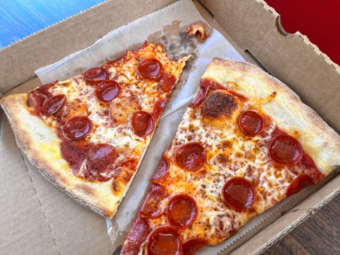 Vinnie's Pizzaria reopened Wednesday morning after a year's closure.