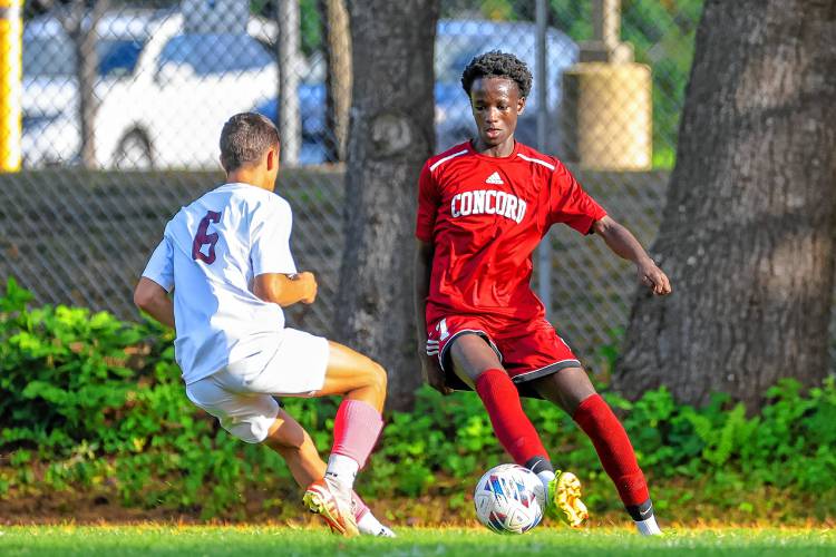 Concord midfielder Sadiki Rukumbuzi (right) looks to dribble around a Timberlane player on Tuesday. Concord and Timberlane battled to a 3-3 draw. Concord midfielder Sadiki Rukumbuzi (right) looks to dribble around a Timberlane player on Tuesday. Concord and Timberlane battled to a 3-3 draw.