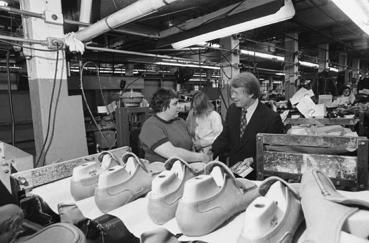 Jimmy Carter meets workers at the J.F. McElwain Shoe Co. in Manchester on Feb. 23, 1976, as he made his final campaign swing through the Granite State before the first-in-the nation primary election. 