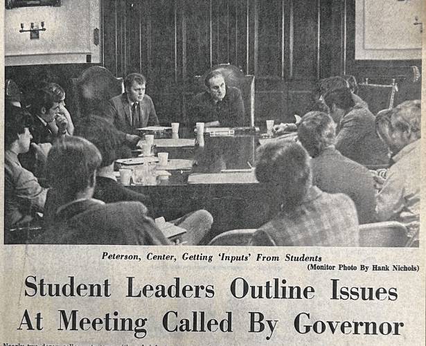 In a Monitor newspaper clipping, a young Rodney Tenney listens to a half-dozen students in the Executive Council chambers beside Gov. Walter Peterson.