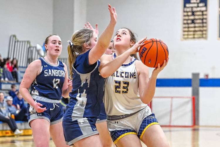 Bow’s Ella Gray (23) drives to the basket during a game at Bow High School on Monday. Gray, a senior, helped lead the Falcons to a 51-17 victory over Sanborn on senior night.