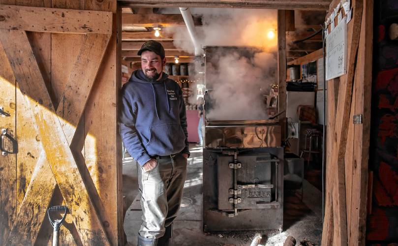 Asa Matras of Matras Maple Sugarhouse in Pittsfield checks on the water content of sap as he and family boil for syrup on Monday, March 10, 2025. The sugarhouse will be open this weekend for the New Hampshire Maple Weekend. To learn more, go to their website at https://www.matrasmaple.com/