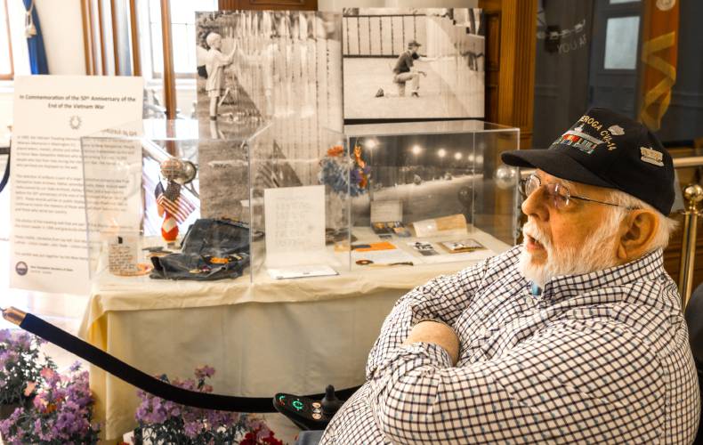Gary Gordon in front of the Vietnam War display at the Hall of Flags at the State House on Wendnesday. 