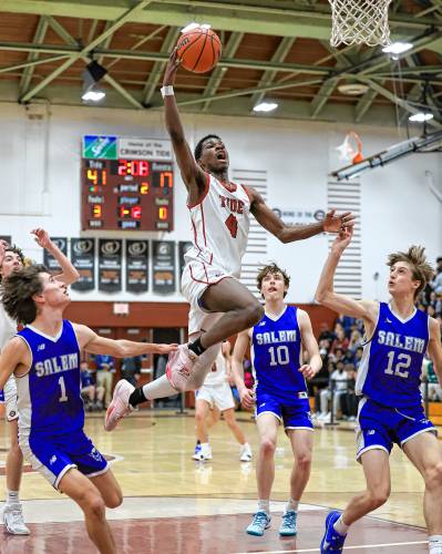 Concord's Alain Twite throws down a dunk during a game against Salem at Concord High School on Tuesday, Feb. 20, 2024. Twite scored 21 points to lead Concord to an 84-58 victory. CHIP GRIFFIN / Photos By Chip Concord's Alain Twite throws down a dunk during a game against Salem at Concord High School on Tuesday, Feb. 20, 2024. Twite scored 21 points to lead Concord to an 84-58 victory. CHIP GRIFFIN / Photos By Chip