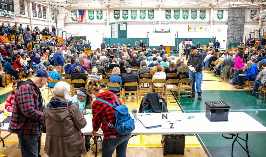 The line to register at the Pembroke School District Meeting before the meeting started on Saturday, March 9, 2024.