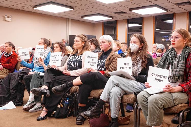 About 15 people, many of whom wore keffiyehs — a scarf or headdress and Palestinian symbol — and “ceasefire now” shirts attended the city council meeting Monday evening to advocate that the council take up a resolution in favor of a ceasefire in Gaza. About 15 people, many of whom wore keffiyehs — a scarf or headdress and Palestinian symbol — and “ceasefire now” shirts attended the city council meeting Monday evening to advocate that the council take up a resolution in favor of a ceasefire in Gaza.