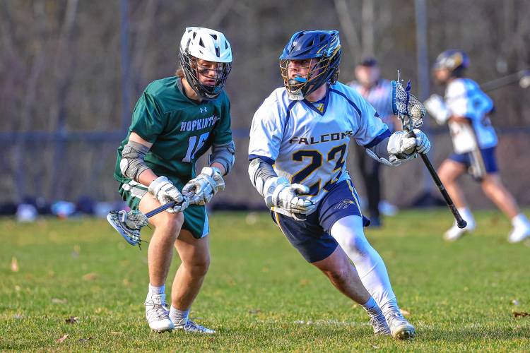 Bow’s Nate Davis tries to navigate around Hopkinton’s Kip Hedquist during Tuesday’s game.