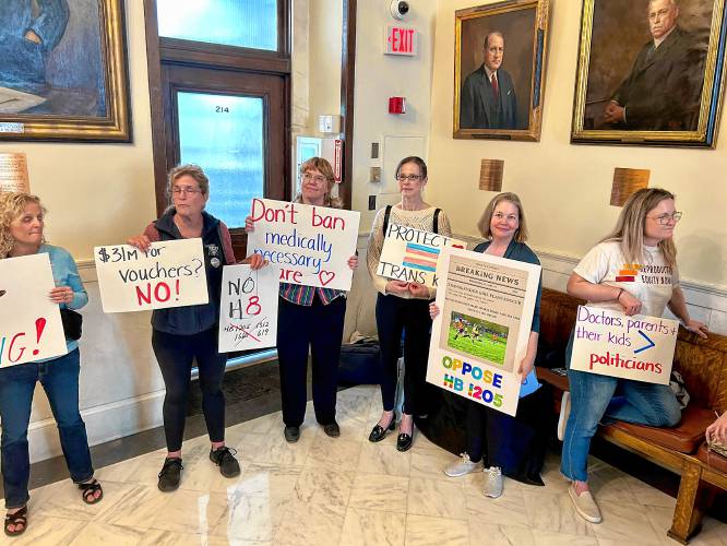 Sara Tirrell (second from right) advocates against a transgender sports ban bill that would ban her daughter, Parker, from playing girl’s soccer.