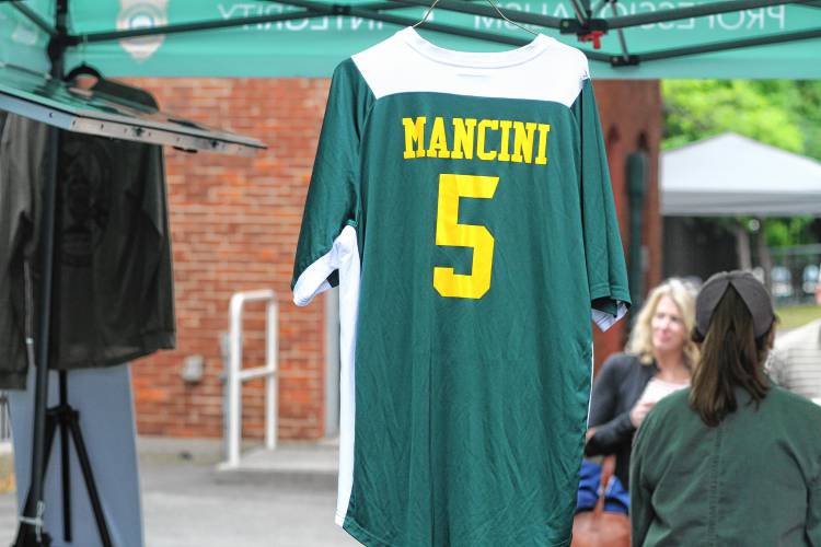 NH Lieutenant Bob Mancini's jersey hangs from a promotional tent, ahead of the fifth-annual North Woods Throwdown between the NH Conservation Officers and the Maine Game Wardens at Gill Stadium on Saturday, June 29, 2024.