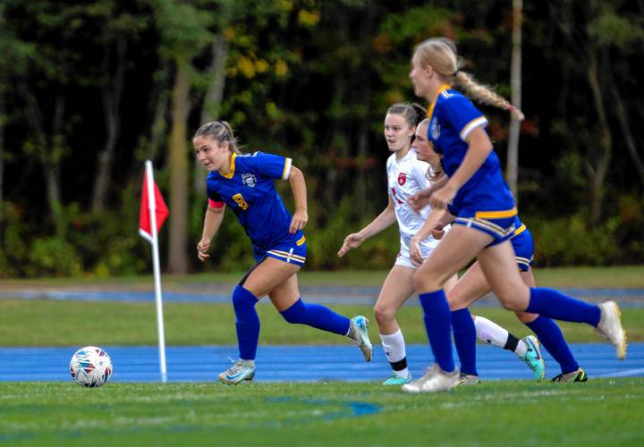 Midfielder Carly Grant (8) leads the pack during first-half action against Hillsboro-Deering on Tuesday.