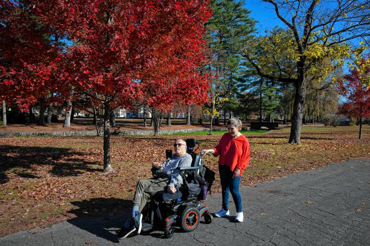 Concord couple James Piet and Patricia Vincent-Piet enjoy the accessibility of Rollins Park, which is close to their South Concord home. However, he is getting used to his new custom chair, which can only be used on paved surfaces.