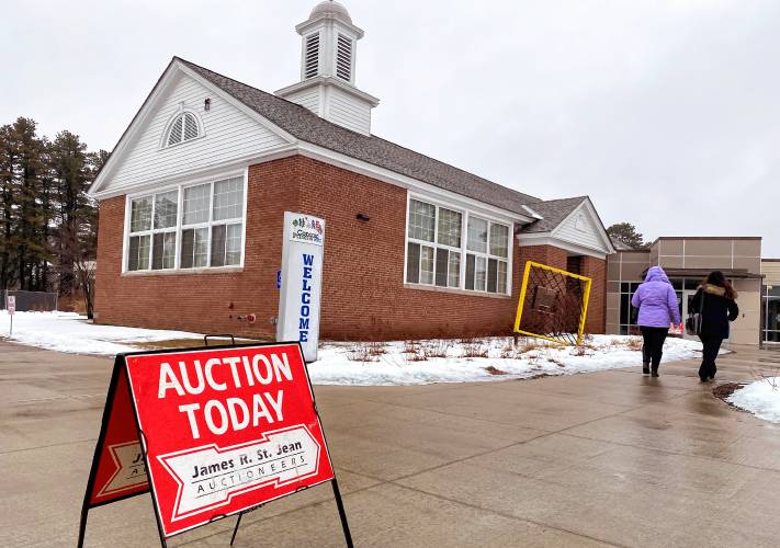 The auction sign outside the Concord Community Center before the auction to sell off properties on Friday, January 26.