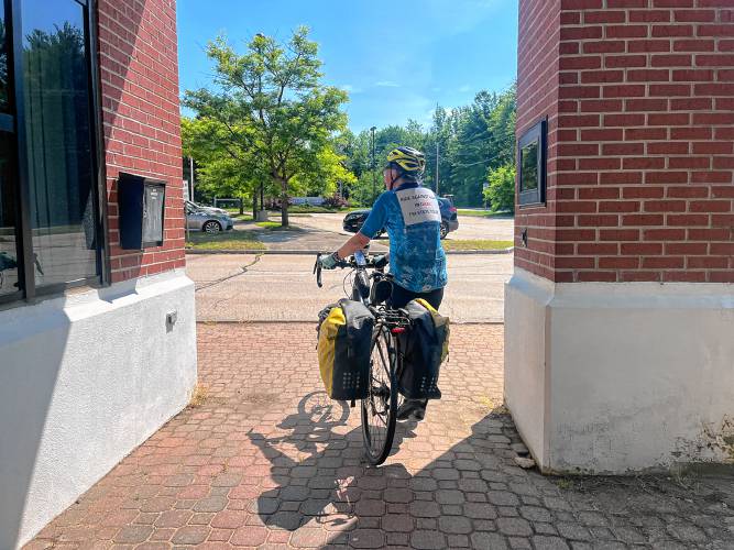 Bob Sanders stops at the Concord Monitor before setting off on 700-mile bike tour to protest the war in Gaza.