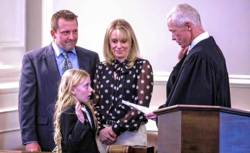 New Hampshire Kid Governor Jade Adams is sworn in by Chief Justice Gordon MacDonald at Representative Hall on Tuesday, January 28, 2025. Adams is a fifth-grade student at Wells Memorial School in Harrisville.