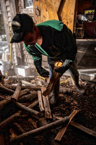 Wille Matras of Matras Maple Sugarhouse in Pittsfield loads wood for the evaporator as he and his family boil for syrup on Monday, March 10, 2025. The Sugarhouse will be open this weekend for the New Hampshire Maple Weekend. To learn more, go to their website at https://www.matrasmaple.com/