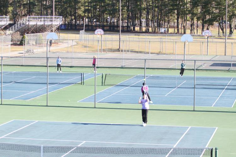 The Concord Crimson Tide girls’ tennis team warms up at Memorial Field in preparation for the upcoming spring season.