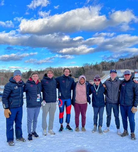 Lucas Golden (right from right) stands with Concord High School Alpine teammates, and head coach and father George Golden (far left) at Crotched Mountain after sweeping the giant slalom and slalom titles at the Division I boys' Alpine skiing championships on Friday, Feb. 16, 2024. Concord finished fourth as a team.