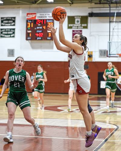 Concord senior Aidah Smalley floats up a shot to give the Tide a 33-30 lead in the fourth quarter against Dover on Friday night.