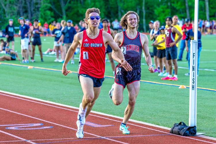 Coe-Brown’s Jamie Lano (1) edges Hanover’s Lucian Gleiser (2) to win the 800 meters by 0.12 seconds at the NHIAA Division II championship on Friday at Oyster River High School in Durham. Hanover won the team title, ending Coe-Brown’s streak at four consecutive championships. Coe-Brown finished second.