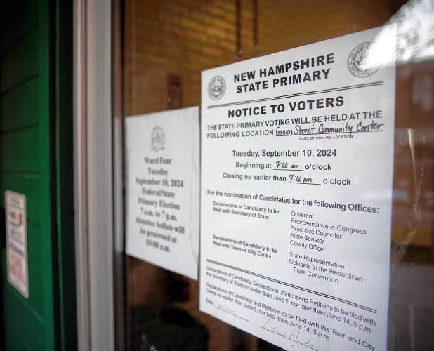 A notice for primary voters on the door of the Green Street Community Center in Concord.
