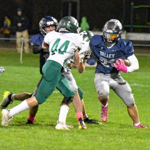 Merrimack Valley’s Reece Clermont (right) looks for a way past Kingswood’s Graham Burke (44). The Kingswood defense shut down the Pride’s run game on Friday night to win 20-17.