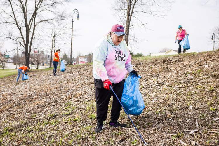 Courtney Robison came down from Franklin to help with the clean up along Water Street near the Common Man on Saturday morning, April 19, 2025. Concord city councilor Jeff Foote led the group as they picked up trash along the Concord corridor.