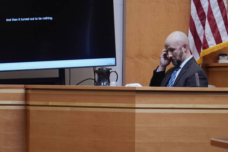 Manchester, N.H. Police Capt. Matthew Larochelle listens to an audio recording of Adam Montgomery during the trial of the Montgomery at Hillsborough County Superior Court, Tuesday, Feb. 20, 2024, in Manchester, N.H. Montgomery is facing second-degree murder and other charges in the death of his daughter, Harmony. (AP Photo/Charles Krupa, Pool)