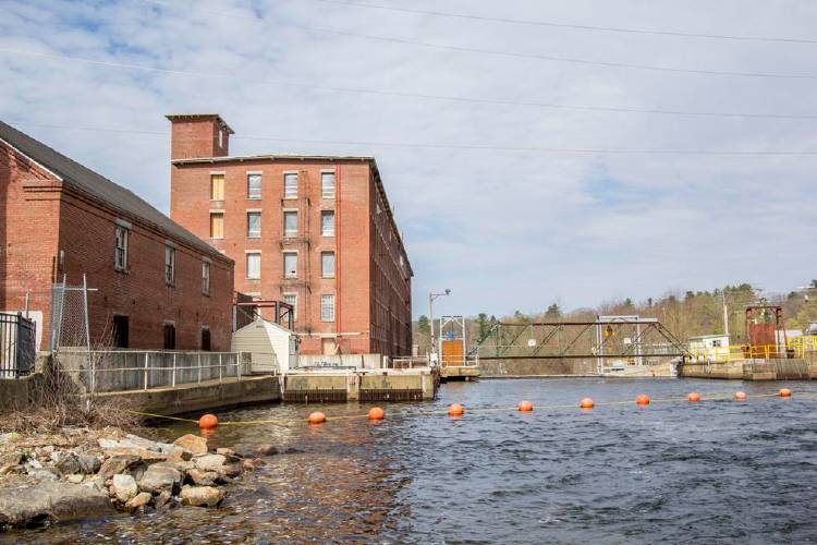 The Stevens Mill complex overlooks the Winnipesaukee River in Franklin. Police and firefighters saved two children from the cold water on Friday. 