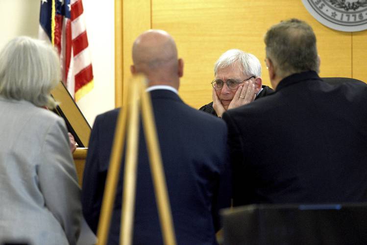 FILE - Superior Court Justice Andrew Schulman conducts a bench hearing with lawyers during the trial for David Meehan at Rockingham Superior Court in Brentwood, N.H., Wednesday, April 10, 2024. In an order Wednesday, May 22, 2024, Schulman described five options for dealing with a dispute that arose after the verdict but said capping the 38 million award at 475,000 as the state proposes would be a FILE - Superior Court Justice Andrew Schulman conducts a bench hearing with lawyers during the trial for David Meehan at Rockingham Superior Court in Brentwood, N.H., Wednesday, April 10, 2024. In an order Wednesday, May 22, 2024, Schulman described five options for dealing with a dispute that arose after the verdict but said capping the 38 million award at 475,000 as the state proposes would be a