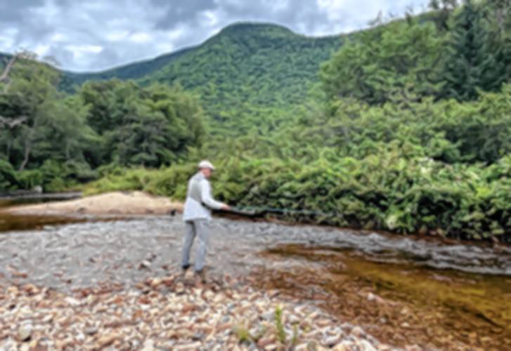 Steve Angers has been fly fishing his entire life. He even wrote a book on it. Here he is casting his line on the shore of the Saco River.
