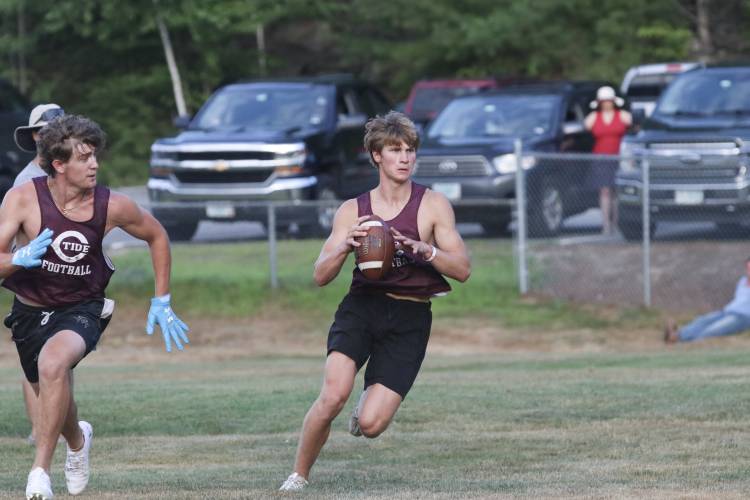 Concord quarterback Colby Nyhan looks downfield during a 7 vs. 7 scrimmage against Manchester West on July 22 at the Rundlett Middle School field. Nyhan is back under center for the Tide in 2024.