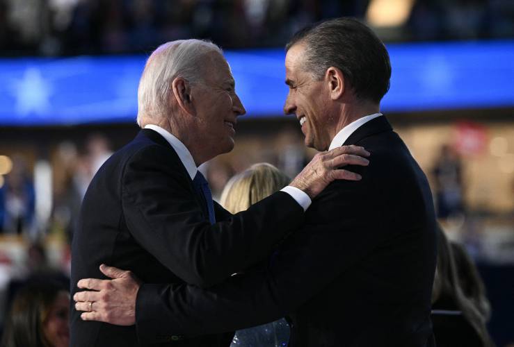 President Joe Biden and his son Hunter Biden hug on stage at the conclusion of the first day of the Democratic National Convention at the United Center on Aug. 19 in Chicago. President Joe Biden and his son Hunter Biden hug on stage at the conclusion of the first day of the Democratic National Convention at the United Center on Aug. 19 in Chicago.
