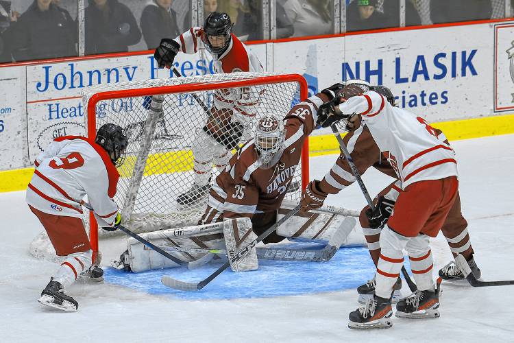 Freshman Nolan Walsh scores a goal past Hanover netminder Jorgen Drent to tie the game at 2-2 in the second period of Wednesday’s Division I boys’ hockey game at Everett Arena. The host Crimson Tide pulled away for a 4-2 win to stay unbeaten on the season at 5-0-0.
