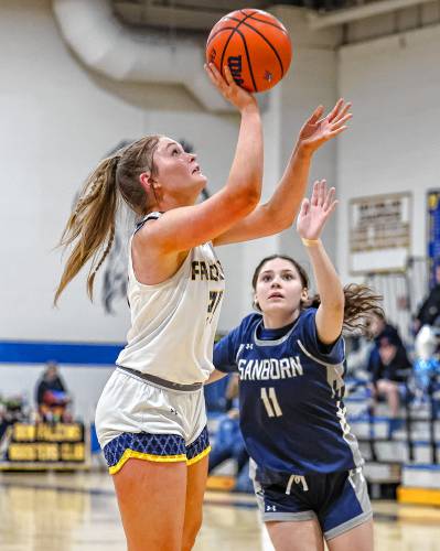Bow’s Kate McGovern takes a shot during a game at Bow High School on Monday. McGovern, a senior, helped lead the Falcons to a 51-17 win over Sanborn on senior night.