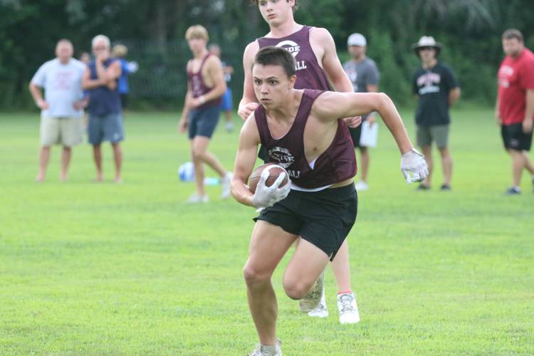 Concord’s Colin Savard runs with the ball during a 7 vs. 7 scrimmage against Manchester West on July 22 at the Rundlett Middle School field. 