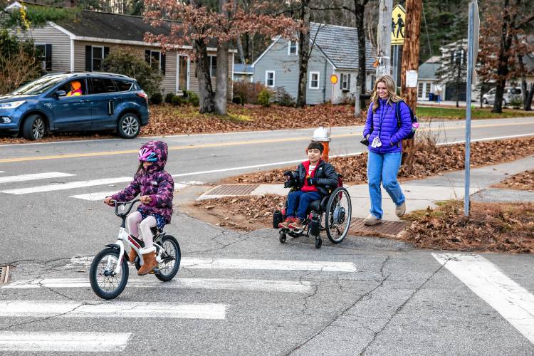 Bodhi Bhattarai travels home with his sister, Devi, and their nanny Lydon Flanagan as they get out from Broken Ground Elementary School.