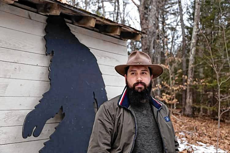 Aleksander Petakov, filmmaker and adventurer, was gifted a nearly eight-foot Bigfoot silhouette by his in-laws last summer, which now welcomes guests to his property in the Monadnock Region.