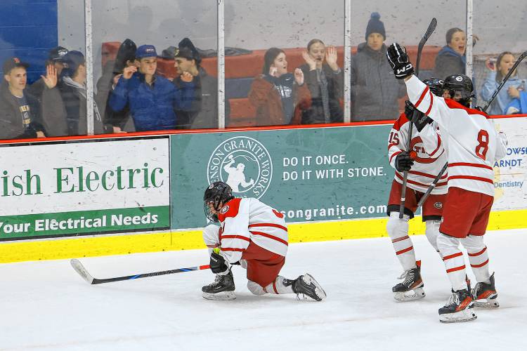 Concord freshman Nolan Walsh scores a quick goal and celebrates near the goalie to tie the game at 2-2 in the second period against the Hanover Bears.