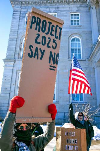 Sandra Tarsa (left), and her husband Graham Baker of East Wakefield joined the rally in front of the State House on Wednesday, February 5, 2025 as part of the national movement to protest the Project 2025.