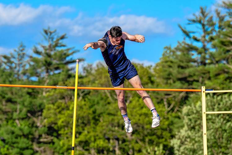 Bow's Ben McDowell clears the bar to win the pole vault at the NHIAA Division II championship on Friday, May 24, 2024 at Oyster River High School in Durham. McDowell cleared 13-10 to win the title and set the Bow High School program record. Jay Smith / NHXCTF