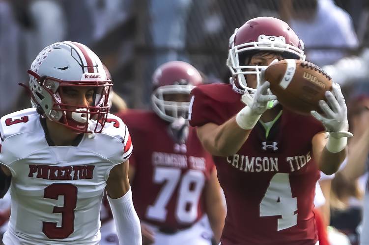 Concord receiver Brett Tuttle makes a finger tip catch against Pinkerton during a game last season on Sept. 30, 2023.