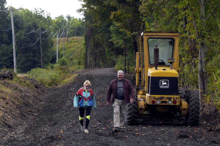 Lind Heim and Donald Moyer walk on a section the Northern Rail Trail in Boscawen in 2022.