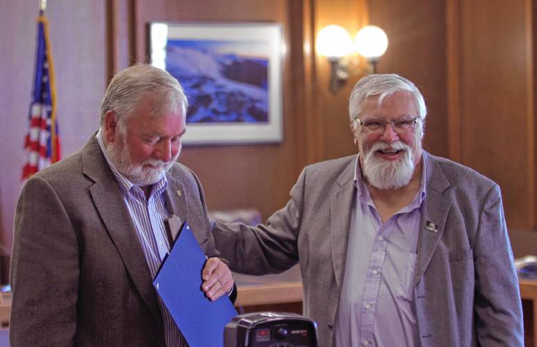 House Speaker Sherman Packard presents former Speaker Steve Shurtleff with a plaque honoring his service on Thursday. Packard described Shurtleff as a close friend after working together throughout the years.