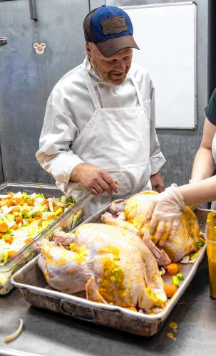 Holiday Inn Executive Chef John Dukette checks on the turkeys that they will be sending to the Windmill.