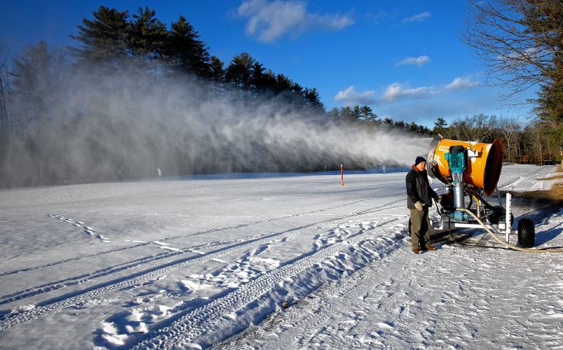 Concord Parks and Recreation Director David Gill looks the snowmaking fan making snow on the Beaver Meadow driving range during a test run on Friday, December 6, 2024. Gill was on hand to ensure the equipment worked properly after the owners left. The city rented the fan, tubing, and generator.
