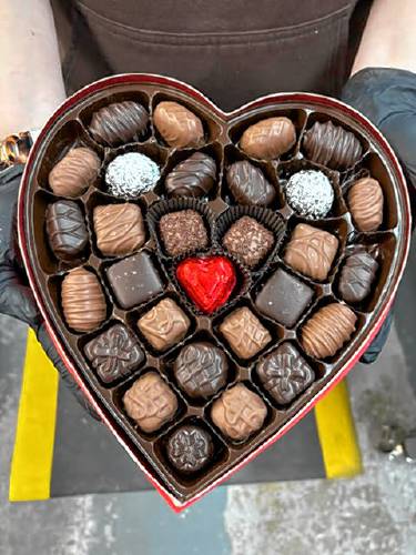 Chocolatiers at the Granite State Candy Shoppe factory on Hall St. Concord prepared chocolates for Valentine's Day on Monday, Feb. 3. The heart box of assorted chocolates is one of the company’s most popular products for the holid