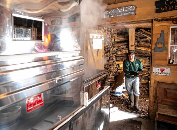 Wille Matras of Matras Maple Sugarhouse in Pittsfield loads wood for the evaporator as he and his family boil for syrup on Monday, March 10, 2025. The Sugarhouse will be open this weekend for the New Hampshire Maple Weekend. To learn more, go to their website at https://www.matrasmaple.com/