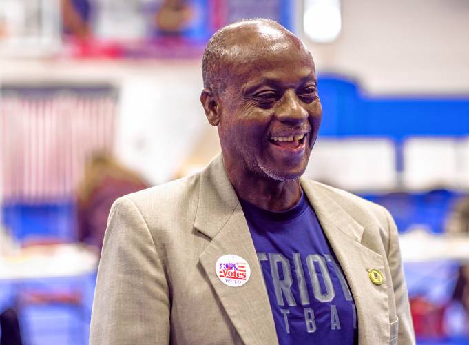 Kayitani Ndutiye reacts after voting for the first time in the New Hampshire Primary on January 23, 2024, days after being sworn in as a United States citizen just last Friday.