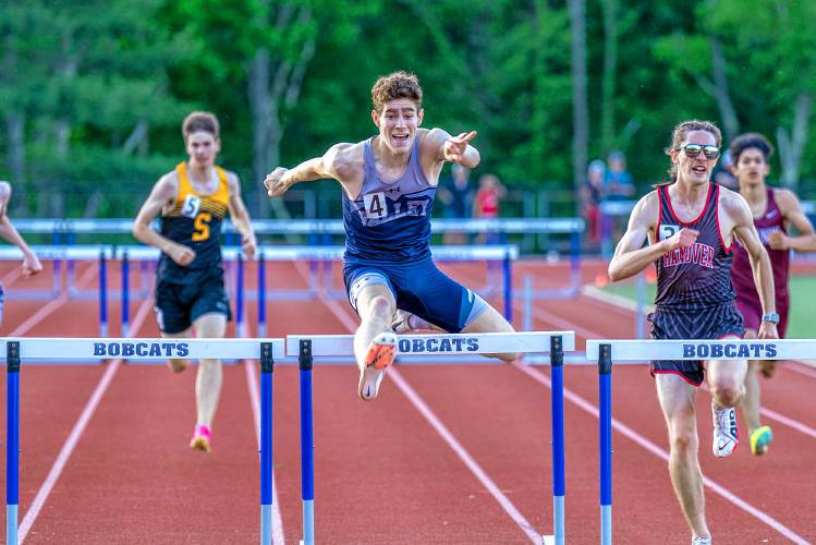 Merrimack Valley’s Mychal Reynolds competes in the 300-meter hurdles at the NHIAA Division II championship on Friday at Oyster River High School in Durham. Reynolds finished the race in 41.14 seconds to win the D-II title. 