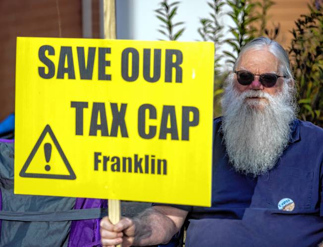  Al Warner, who is running for Ward 3 city council in Franklin, greets voters outside the Franklin Middle School on Tuesday. 